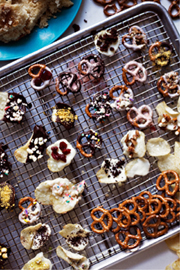 Various candied pretzels on a baking sheet