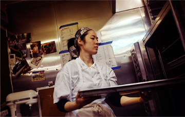 Placing a tray into an oven