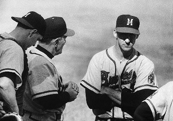 Warren Spahn (right) conferred with catcher Del Crandall (left) and manager Fred Haney (center) shortly before being removed from Game One of the 1957 Series. (WHI IMAGE ID 11642)