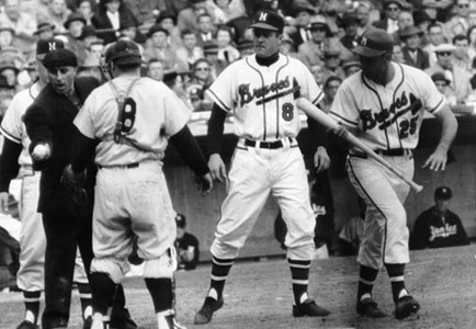 Nippy Jones (25) was awarded first base after umpire Augie Donatelli showed Yankees catcher Yogi Berra (8) the shoe polish scuff mark on the ball. (DAVID KLUG COLLECTION)