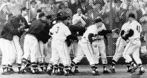 Eddie Mathews (41) was greeted at home plate after his tenth-inning home run evened the Series at two games apiece. (DAVID KLUG COLLECTION)