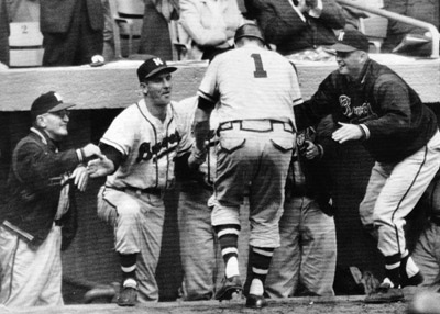 Fred Haney (left), Del Rice (7), Taylor Phillips (in jacket), and other ecstatic players greeted catcher Del Crandall (1) after his eighth-inning home run gave Milwaukee a commanding 5–0 lead in the Series-deciding seventh game. (DAVID KLUG COLLECTION)