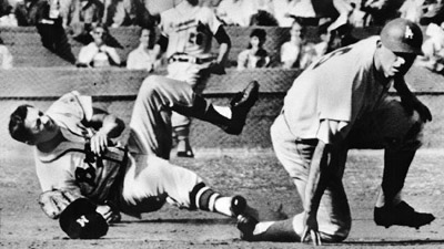 Johnny Logan was injured in Game Two when the Dodgers’ Norm Larker attempted to break up the double play. (NATIONAL BASEBALL HALL OF FAME LIBRARY)