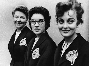 Braves office personnel, including (left to right) Mary Miklas, Donna Hempton, and Anita Seckinger, sported dark blazers decorated with the club insignia, similar to those worn by the players during road trips. (MILWAUKEE JOURNAL SENTINEL)