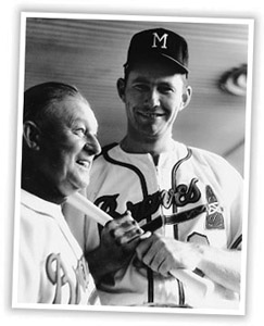 Charlie Dressen (next to Joe Adcock) was relieved of his managerial responsibilities on September 2, 1961. (ROBERT KOEHLER COLLECTION)