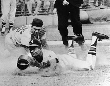 Felipe Alou (avoiding a tag by Cardinals catcher Tim McCarver) brought speed to the Braves’ potent 1964 lineup. (ROBERT KOEHLER COLLECTION)