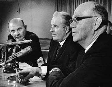 (From left to right) Milwaukee County Board chairman Eugene Grobschmidt, county executive John Doyne, and Milwaukee Sentinel sports editor Lloyd Larsen held a press conference at General Mitchell Field upon returning from a meeting with National League owners. (MILWAUKEE JOURNAL SENTINEL)