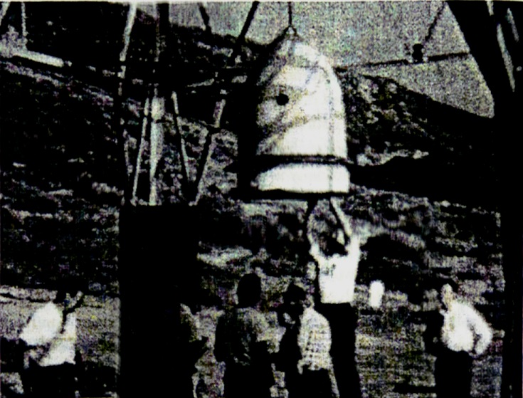 One-meter-diameter
tethered model suspended from the Atlas missile test tower at Point
Loma in
preparation for single-shot high-explosive tests.