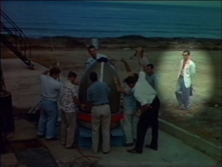 Freeman
Dyson (carrying briefcase) at the Point Loma test site, summer 1959.
Clockwise
from top, surrounding the meter model: Ed Day, Walt England, Brian
Dunne, Perry
Ritter, Jim Morris, Michael Feeney, W B McKinney, Michael Ames.