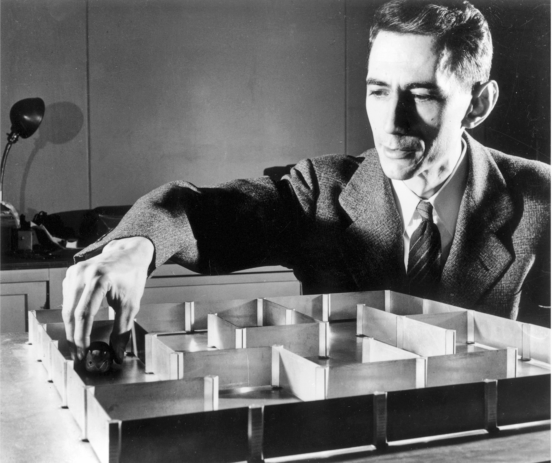  10th May 1952:  Dr Claude E Shannon a mathematician at the Bell Telephone Laboratories with an electronic mouse which has a 'super' memory and can learn its way round a maze without a mistake after only one 'training' run.  (Photo by Keystone/Getty Images)