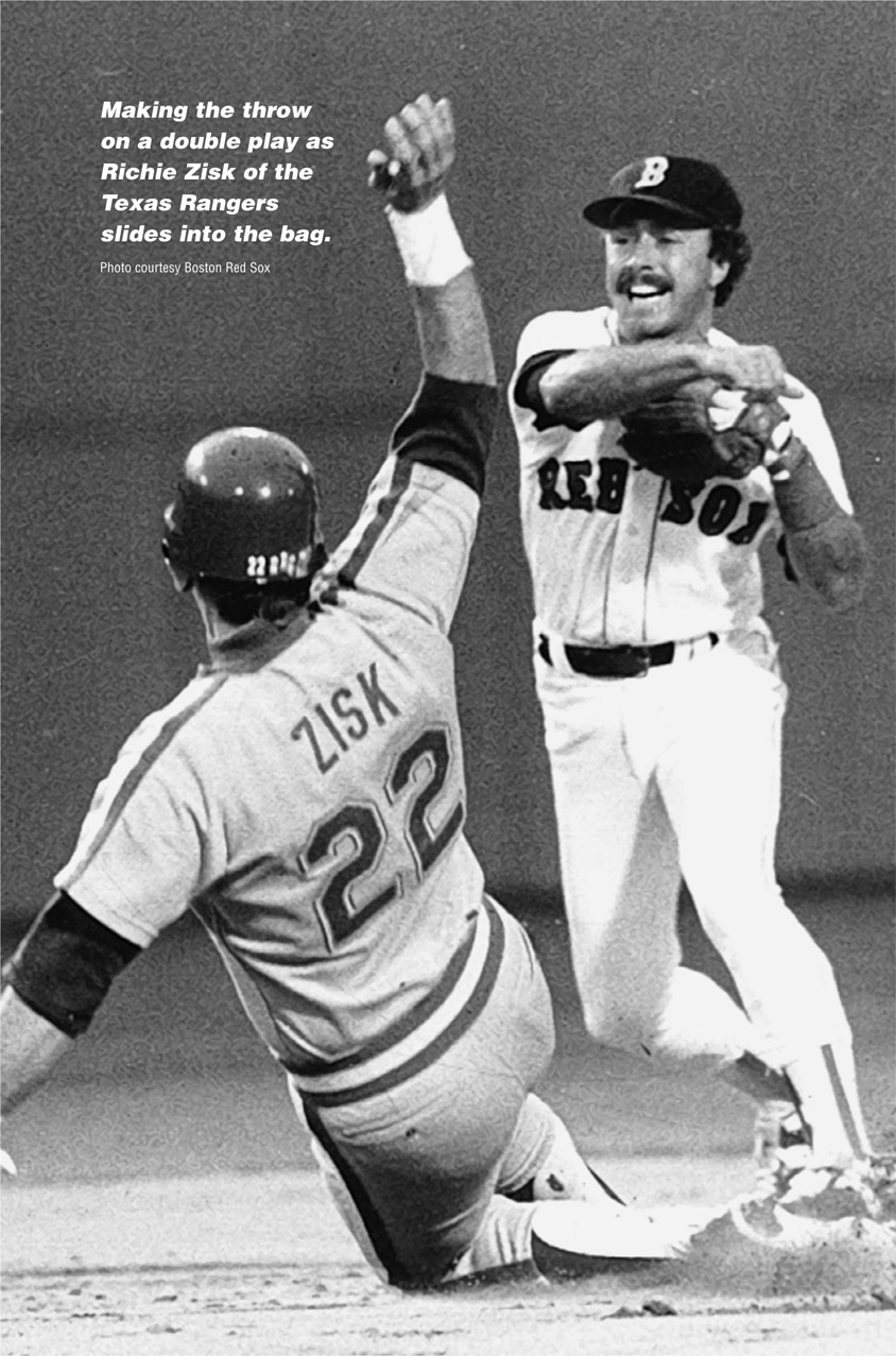 Making the throw on a double play as Richie Zisk of the Texas Rangers slides into the bag. Photo courtesy Boston Red Sox B RED SOL ZISK 22 22