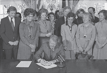 Jimmy Carter signs a bill extending...