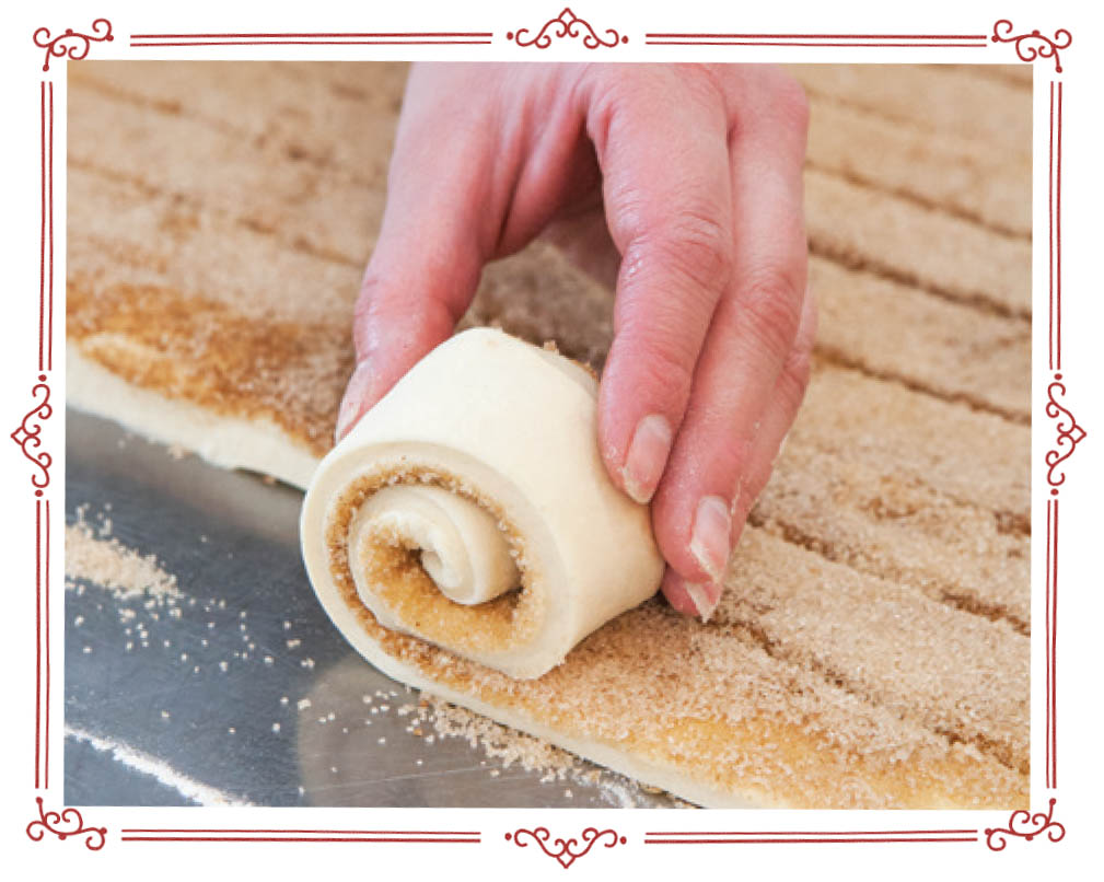 Picture of giant cinnamon roll process.