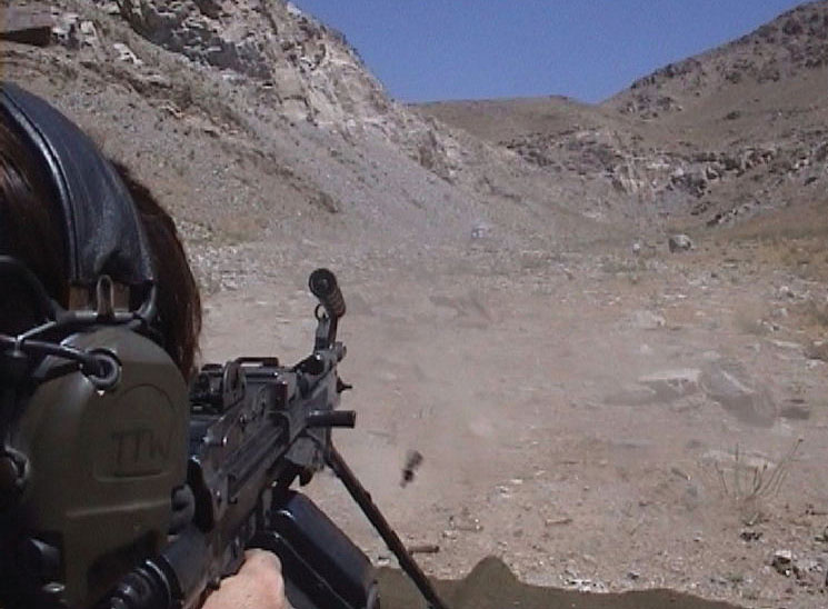 The Squad Assault Weapon (SAW) Minimi 5.56 mm drum-fed machine gun gets put through its paces on the ranges.