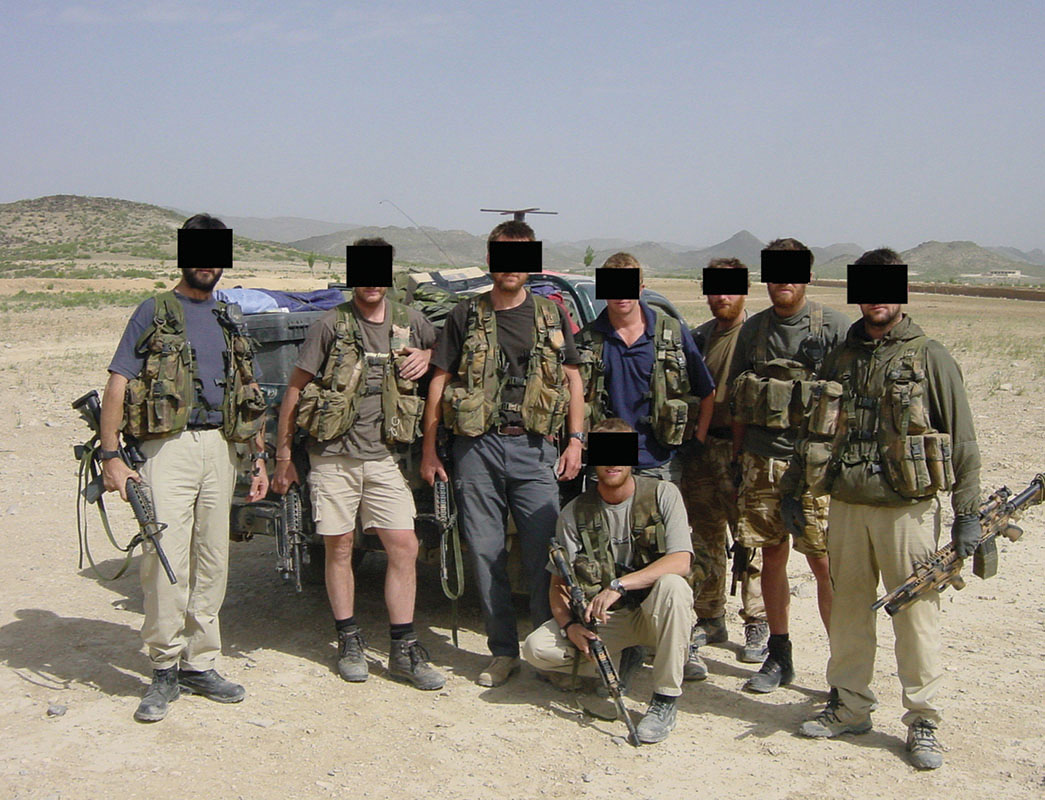 SBS on a vehicle patrol. They carry Diemaco 5.56 mm assault rifles with under-slung Hechler & Koch 40 mm grenade launchers. A satellite comms antennae can just be seen on the roof of the vehicle.