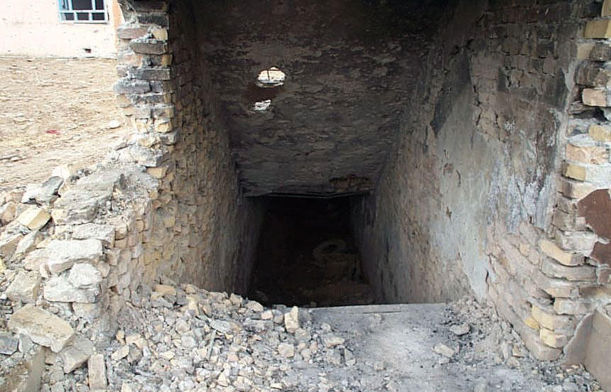 Blasted remains of the entrance to the enemy stronghold in the basement beneath the fort. Eighty-six enemy soldiers held out down there for seven days.