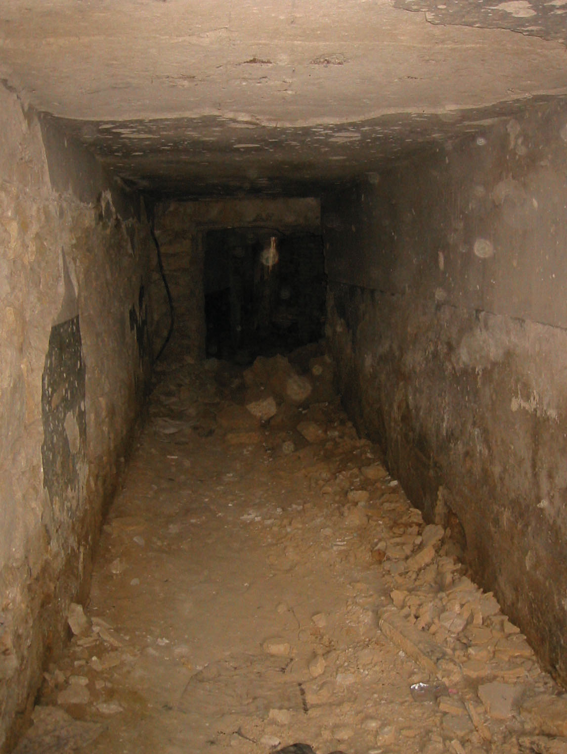 The fort basement immediately after the enemy have been forced to surrender. Discarded weaponry lies amongst the rubble of airstrikes.