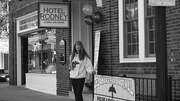 The author outside the haunted pop-up in Lewes, Delaware