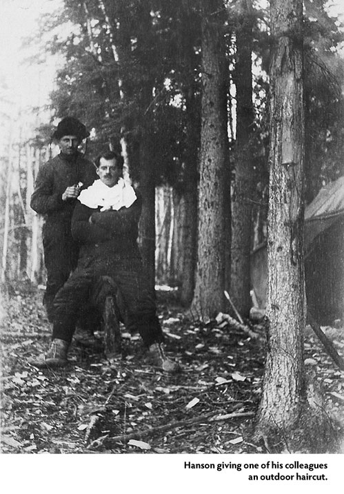 [image] Hanson giving one of his colleagues an outdoor haircut