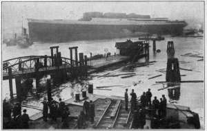 Photograph by Underwood & Underwood, N. Y. SCENE IN GERMAN SHIP-BUILDING YARD The great ship in the background has just been launched. Though the war left Germany no man to spare, every effort has been made to materially increase the country's merchant marine. To-day Germany's mercantile fleet is stronger than ever.