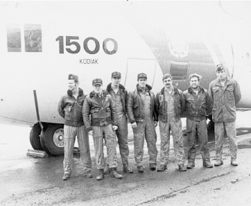 Coast Guard 1500 took off from Adak for Kodiak and home minutes after Alfa Foxtrot 586 left Adak on its PARPRO mission. The Coast Guard crew would spend more than seventeen hours in the air during the next twenty-four hours, many at low altitude at night and in bad weather atop the rafts. The crew left to right: Lt. (jg) Bill Porter (plane commander), PO 1st Class Barry Philippy (navigator), PO 3d Class Ray Demkowski (radio operator), PO 2d Class Ken Henry (loadmaster),PO 1st Class Darryl Horning (flight engineer), PO 3d Class Butch Miconi (scanner),and Lt. (jg) Rick Holzschu (copilot). (Seaman Dan Mallot not pictured.) U.S. COAST GUARD