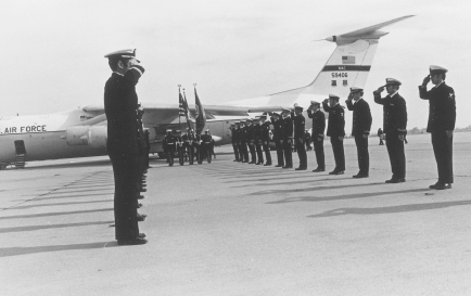 Air Force 59406 on the ramp at NAS Moffett Field on Saturday, 4 November, soon after landing. The squadron’s air antisubmarine warfare technicians, shop mates of the three who died on board the Mark-7 raft the week before, have formed an honor cordon. A navy color guard is leading the three coffins off the aircraft. MATT GIBBONS