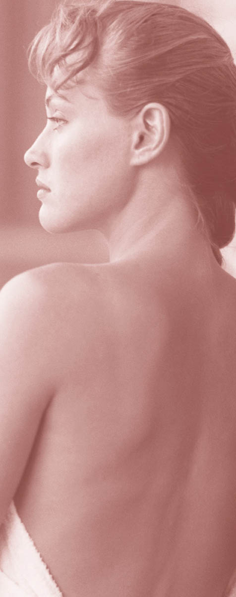 A woman posing with her shoulder bare.