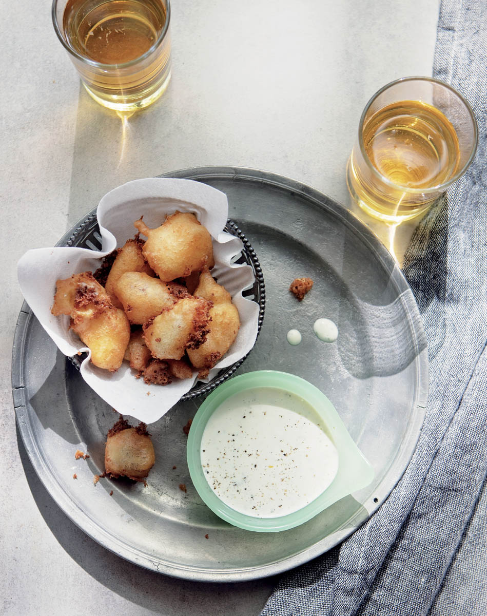 A tray of food with a dish of really ranch dressing