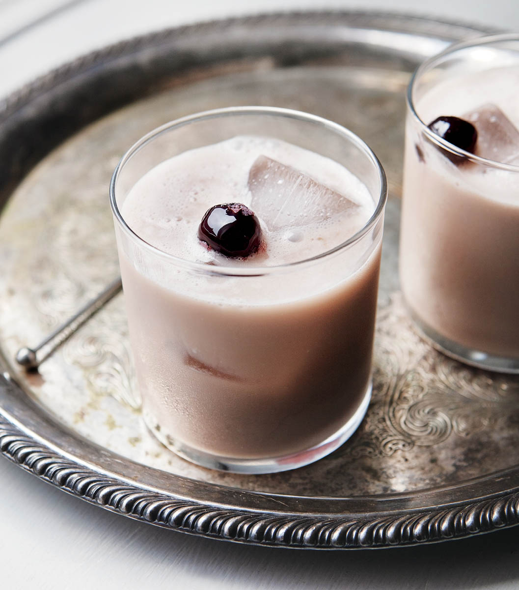 A tray with glasses of kefir and cassis sours