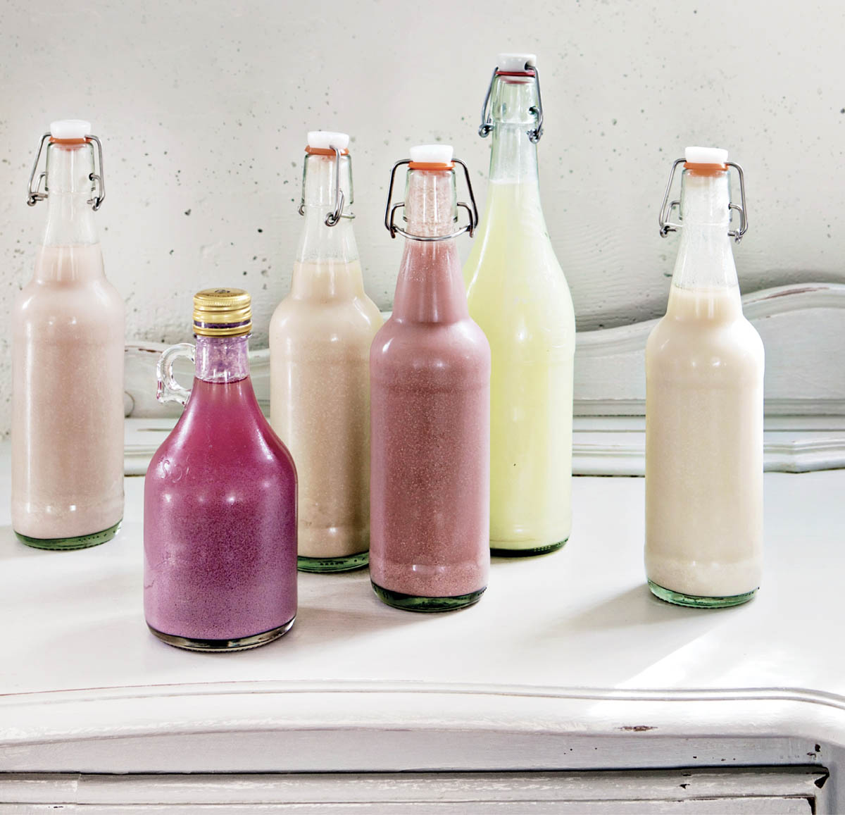 Bottles of various dairy beverages and libations