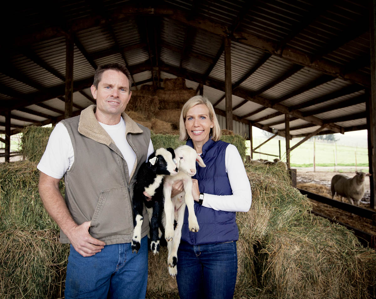 The owners of Bellwether Farm with some dairy goats