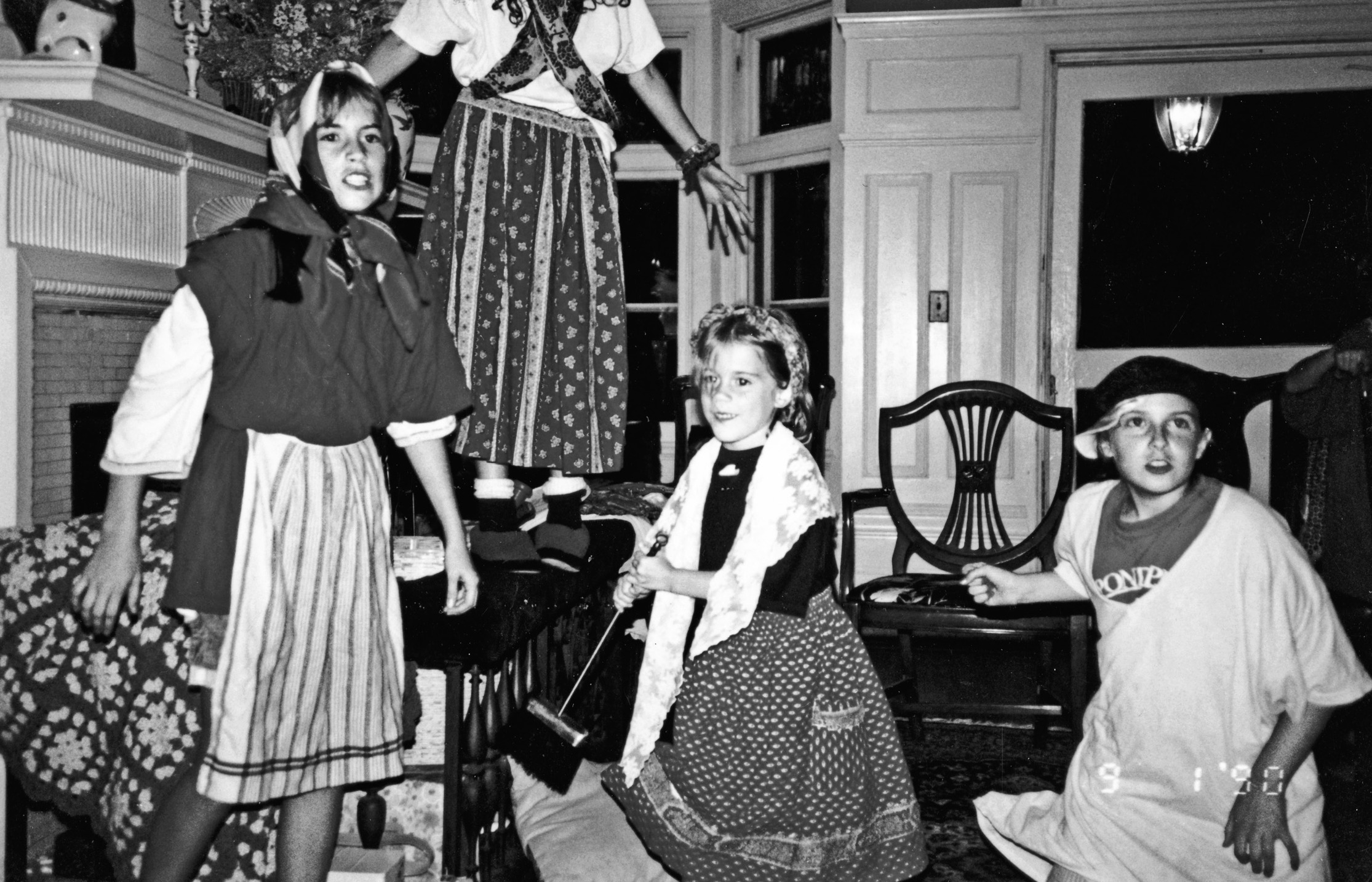 An early love of history and drama: Alli (center) plays the role of Cosette alongside her big sister, Emily, and friends in a living room production of  Les Misérables  at the Pataki home.