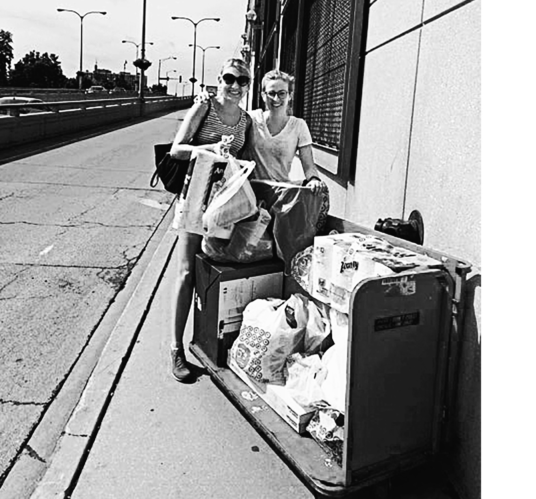 Friends Margaret and Charlotte made so many trips to Target to stock Alli and Dave’s new apartment that the staff let them take a shopping cart home.