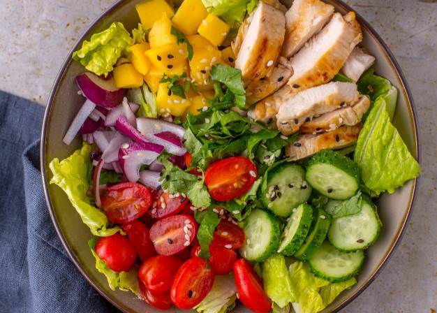 Grilled chicken mango salad with cilantro, cucumbers, cherry ...