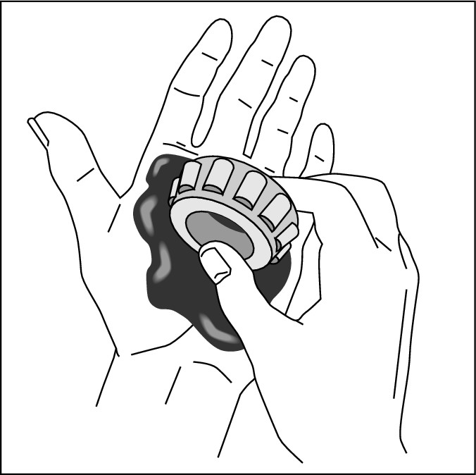 Figure 15-8:  How to pack bearings with your bare hands.