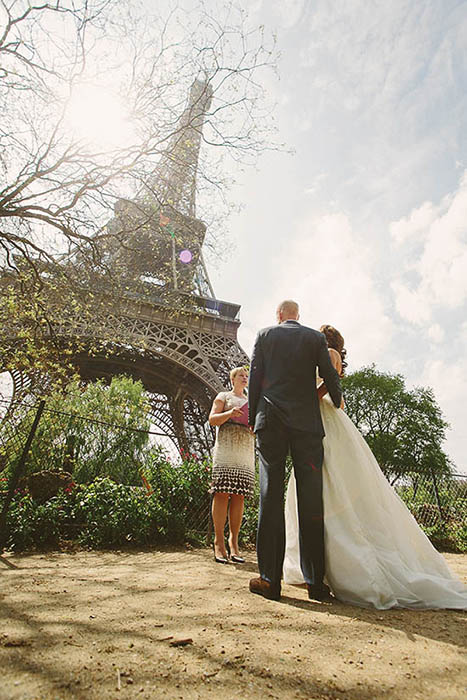 Photo of couple near Eiffel Tower.