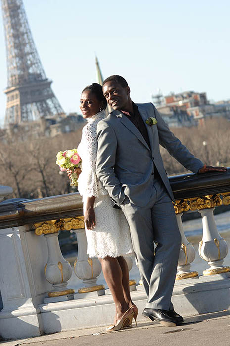 Photo of couple near Eiffel Tower.