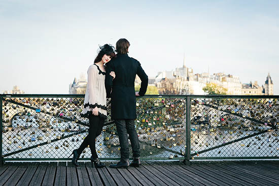 Photo of couple on bridge.