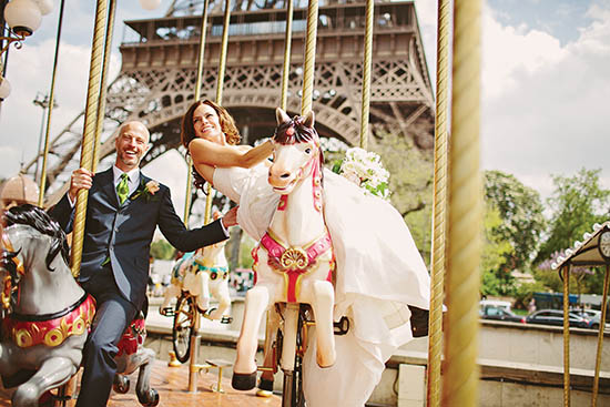 Photo of couple on carousel.