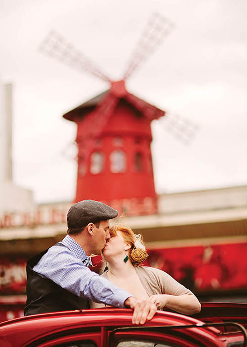 Photo of couple in front of windmill.