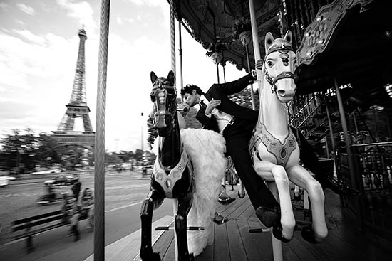 Photo of couple on carousel.