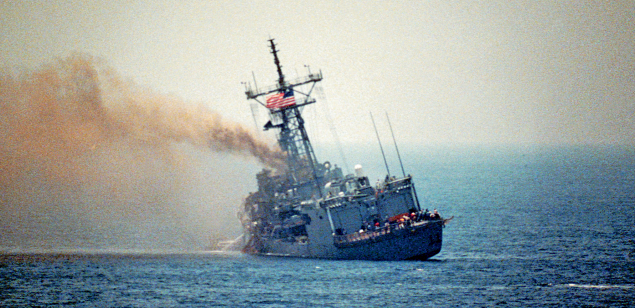 A port quarter view of the guided missile frigate USS STARK (FFG-31) listing to port after being struck by an Iraqi-launched Exocet missile.