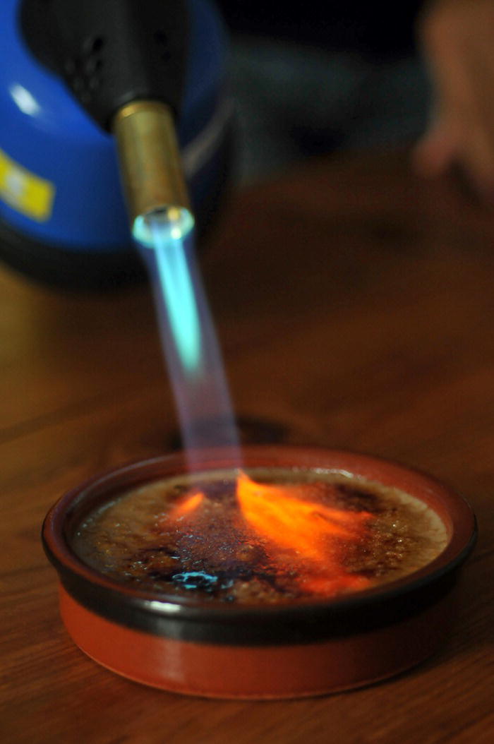 Photo displaying heat increasing the rate of a reaction of a crème brûlée.