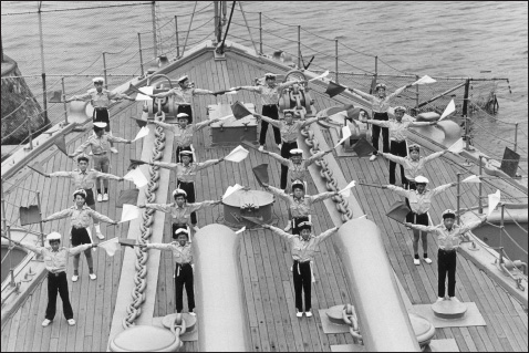 Photo 5.2. A prewar shot of Japanese “Sea Scouts” practicing semaphore on the deck of Mikasa. (U.S. Naval Institute Photo Archives)