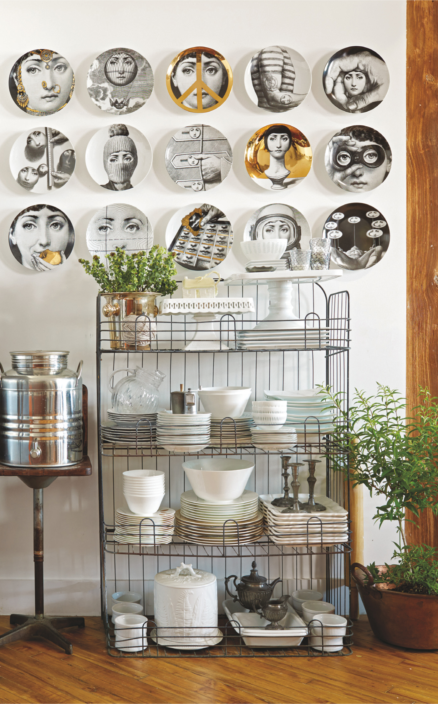 If you have pretty dishware that you don’t use every day, displaying it is better than keeping it hidden away. This perfectly spaced collection of Fornasetti plates looks like one large piece of art. A vintage water dispenser picks up on the shine in all of the plates.