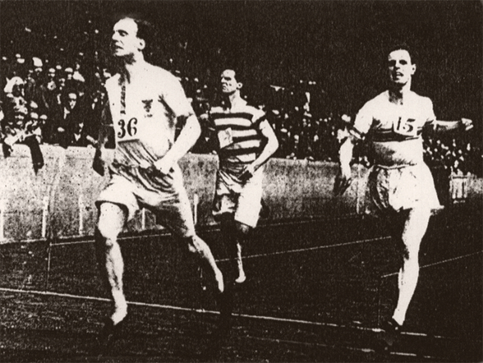 Eric and two other men running on a track.