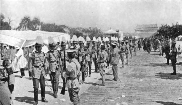 The Funeral of Yuan Shih-kai: The Procession passing down the great Palace Approach, with the famous Ch'ien Men (Gate) in the distance.