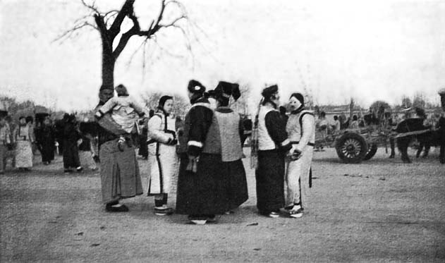 A Manchu Country Fair: The figures in the foreground are all Manchu women and girls.