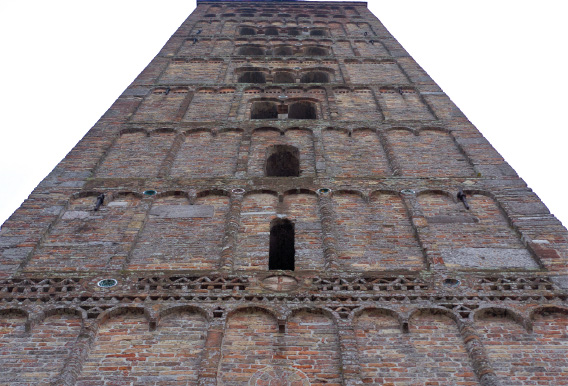 Abbazia, façade, detail of a window, and the Campanile.