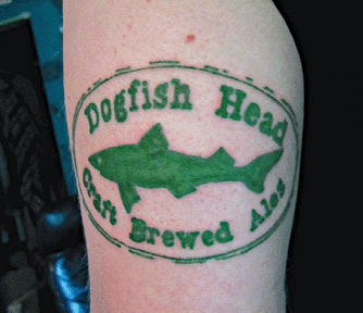 A color photograph depicting The Dogfish Head tattoo on a fan's arm.